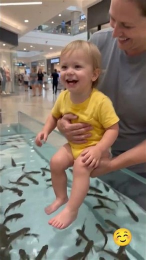 Baby Laughs as Hundreds of Fish Gather Around Tiny Feet! 🐟😂 Cutest Fish Spa Ever #Shorts
