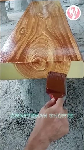 Painting | Cement tables in the park painted with wood grain patterns