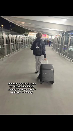 Kissing with Lip Gloss: A Playful Moment