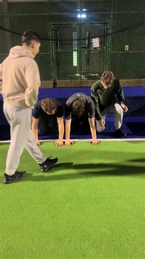 Field Hockey Men Performing Cheer Stunts POV