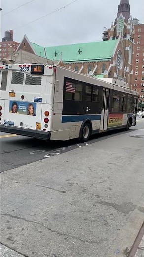 Q111 Bus is driving through Jamaica in Queens, New York. Hybrid Electric Bus Orion VII HEV #mta #ny