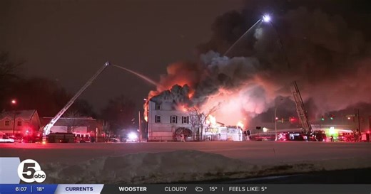 Akron firefighters battle blaze at condemned apartment building