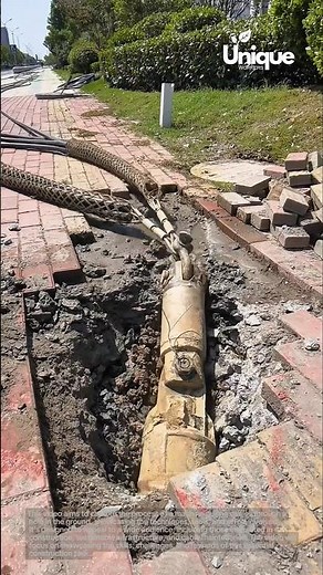Cable pulling: machine pulling cables through a hole in the ground