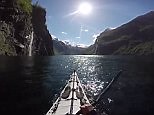 Picturesque views of Norway seen from the front of a kayak