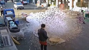 Street vendor gets face-full of popcorn after massive explosion