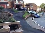 Terrible parking fail as Porsche drives over wall and onto another car