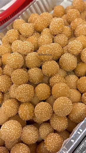 Bite‑size sesame balls with the perfect crispy‑chewy texture. Ingredients: ½ cup potato flakes ¾ cup sugar 1½ cups boiling water 1 bag glutinous rice flour 1 cup rice flour 1½ tbsp baking powder 1 can coconut milk Sesame seeds for coating Steps: 1. Mix the potato flakes, sugar, and boiling water until smooth. 2. Add the glutinous flour, rice flour, and baking powder. 3. Pour in the coconut milk a little at a time until you get a soft dough. Add a bit of water if the dough feels dry. 4. Let the d