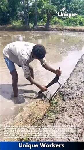 Hard Mud Work in Village Pond: Man Digging Thick Wet Clay by Hand