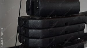 plates weighs stack moves, lifts, rises and pulls up in fitness gym. Working mechanism of rack machine