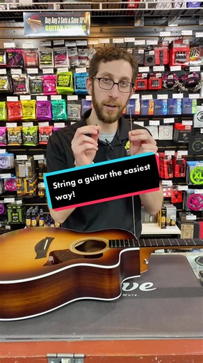 Our superstar manager Kevin teaches how to easily string an acoustic guitar in just about a minute! Send this video to a friend who needs to change their strings! :) #guitartok #delcomusic #georgesmusic #delco #musictok #taylorguitars #acousticguitar @taylorguitars