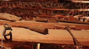 Medevil shipbuilding tools exposed on wooden table middle age workshop shipyard shipwright vessel fifteenth century naval construction marine engineering maritime explore expedition carpentary 15th