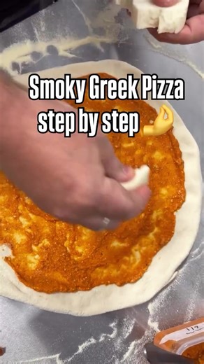 This Greek Pizza Is a Problem Smoked cured ham, oven roasted pepper sauce, fior di latte, feta & fresh green onions... finished with a drizzle of olive oil. One bite and you'll get it #pizzalovers #neapolitanpizza #homepizza #pizzareel #pizzata