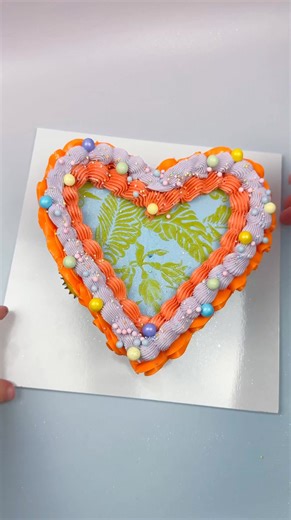 2.8K views | One of our fave 2025 cake trends? Pull-apart cupcakes! 療朗 We’re loving how they transform individual cupcakes into a show-stopping centerpiece — fun to serve, easy to grab, and always a hit. @yoras.cakes nailed this vibrant tropical heart design, and we’re obsessed with those bold @colour.mill buttercream shades. Total summer vibes!  Have you tried this trend yet? All supplies available at The Cake Decorating Co. | The Cake Decorating Company | Facebook