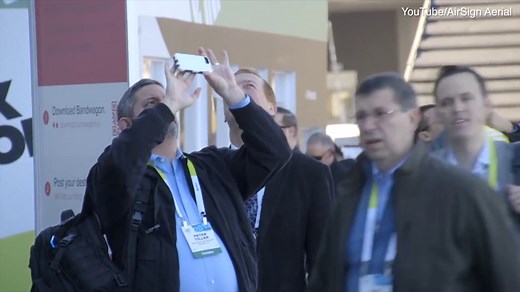 Crowds watch in awe as digital skywriting appears from planes