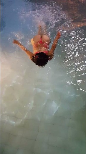 Sexy Colombian Girl Swimming in the swimming pool in bikini