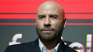 John Travolta chokes up in memorium speech
