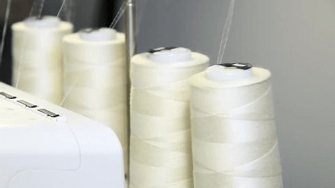 clip-3996120181-close-up-bobbin-threads-parts-sewing-machine-process