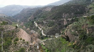 Drone footage of the gorge beyond the Beznar reservoir and dam in the Lecrín Valley, Granada, Spain