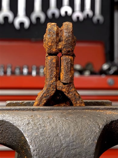 Rusty metallic hinge restoration with chemical spray.