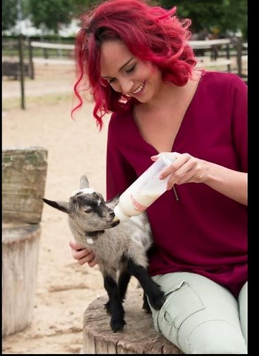 Cute Baby Goat Bottle-Fed by a Red-Haired Woman 🍼🐐