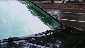 Raining on car front glass, windscreen wipers work, day rain Stock Video