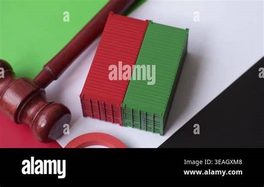 The cargo container ban on the UAE flag as a conceptual backdrop. The cargo container embargo Stock Video Footage - Alamy
