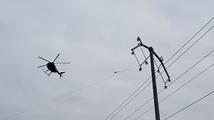 Here’s why a helicopter is flying so close to power lines in Fort Wayne