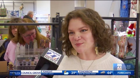 Shoppers explore Black Friday vendor's market at West Ridge Mall