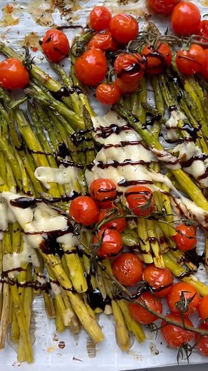 Baked Balsamic Asparagus 1 pound thick asparagus 2 tablespoon olive oil, divided Kosher salt and pepper, to taste 1 teaspoon Italian seasoning 2 pints cherry tomatoes on the vine 1/2 cup freshly shaved parmesan cheese 2 tablespoon balsamic glaze Optional: 1 tbsp chopped parsley Preheat the oven to 400ºF and line a sheet pan with parchment paper. Trim about 1 inch off the ends of your asparagus and place it on the sheet pan. Drizzle with 1 tablespoon of the oil. Sprinkle with salt and pepper, and