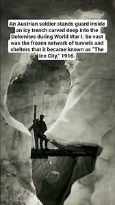 An Austrian soldier stands guard inside an icy trench carved deep into the Dolomites