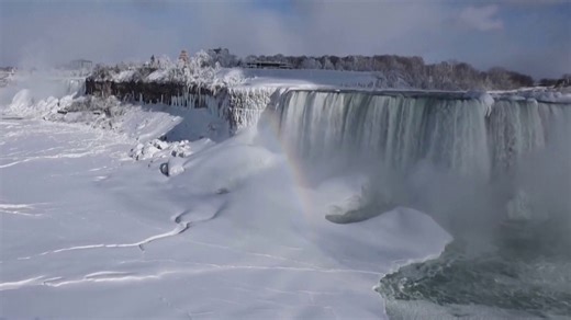 Partially frozen Niagara Falls attracts tourists in below freezing temperatures