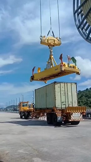 Crane Lifts Heavy Container in Industrial Area