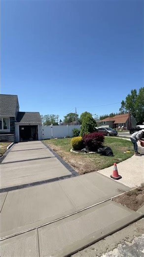 Lindenhurst concrete driveway with paver border concrete sidewalk