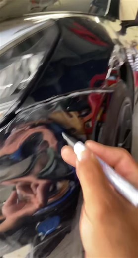 Repairing Scratches on a Tesla with Paint Marker