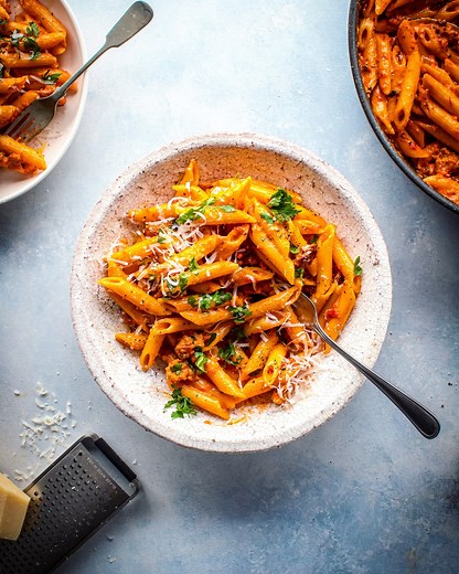 Vodka Penne Pork Ragu | This is one of my absolute favourite weeknight pasta dishes, its Vodka Penne with a bit of a twist. I’ve added some pork sausage to give the creamy sauce a meaty ragu and it really is the ultimate comfort food! Make it tonight x Serves: 4 1 tbsp olive oil 500g sausage meat, removed from skin 2 tsp fennel seeds 2 garlic cloves, sliced 4 tbsp vodka 1 x 400g tin finely chopped tomatoes 2 tbsp Tomato purée 250ml double cream 350g penne pasta 25g parmesan, finely grated Large 