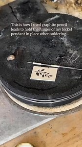 Brilliant soldering tip from@willowandtwigg! When attaching hinges for a book locket, they used simple graphite pencil leads to keep the silver tubing steady. Graphite withstands torch heat and resists solder flow making it a clever, stress-free solution for hinge work.—#jewellerymaker #jewellersworkshop #makingjewelry #whatsonyourbench #silversmith #metalsmith #soldering #silverjewellery #makingjewellery #howitsmade #whatsonmybench #handmadejewellery #jewellerymakingtips #jewelrymakingtips #jew