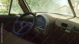 Discarded dusty Truck Steering wheel and dashboard in Namibian Desert - Medium close-up static shot