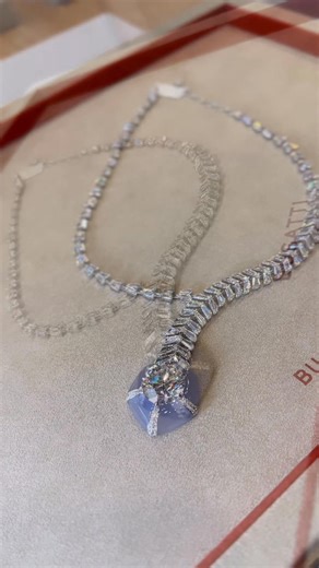 A masterpiece from creative duo of Busatti 1947, a magnificent 20-carat round brilliant-cut diamond wrapped around with lilac chalcedony and 30-carats of custom flame-cut diamonds. A pure sentiment to the artistry and creativity of the house. | Champagne Gem