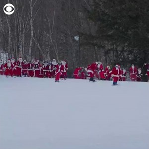 SKIING SANTAS: Hundreds of skiers and snowboarders dressed in Santa costumes for a ski resort’s 21st annual fundraiser on Monday. Sunday River Resort’s event raised over $5,000. | CBS News