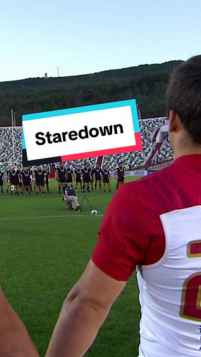 Intense Staredown: Rugby Battle Between France and New Zealand