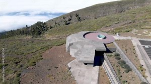 cinematic aerial of futuristic visitor center at the Roque de los Muchachos Observatory