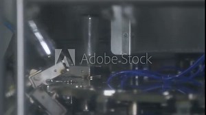 Washing and cleaning of milk bottles before filling with milk at a dairy factory.