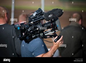 broadcast video camera man men cameraman cameramen digital tv  production company television outside broadcast broadcasting Stock Photo - Alamy