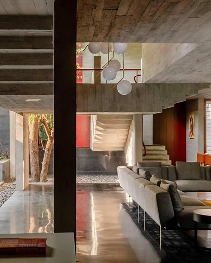 Kelly Behun on Instagram: "‘Trees Sliced Through’ residence in Ahmedabad, India, with its striking red front door, engineered with a counter-rotating pivot mechanism that makes it appear to float / designed by @matharooassociates / 📸 @panjwani.vinay & @edmundsumner"