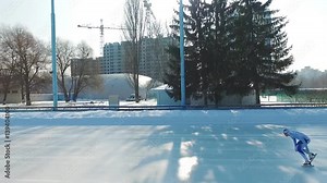 Speed ice skater skating on outdoor race HD video. Professional athlete training for winter olympic side view