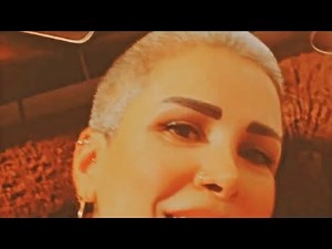 Woman headshave in barbershop by barber