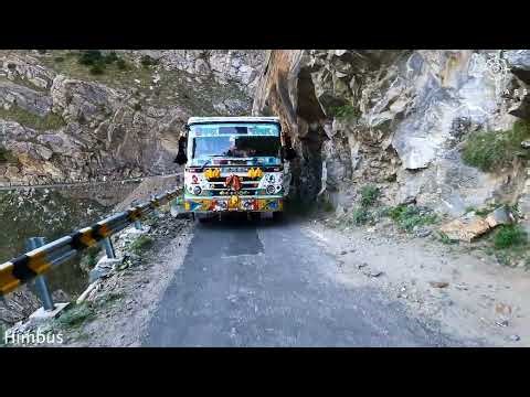 Bus Squeezes Between Cliff & Edge of Road