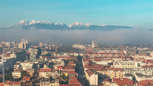 Ljubljana Slovenia time lapse city skyline and Kamnik Savinja Alps mountain range