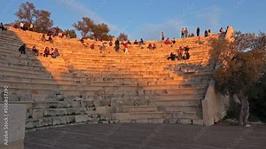 Kas, Turkey - 13th of January 2022: 4K Panning evening Kas theater and resting people