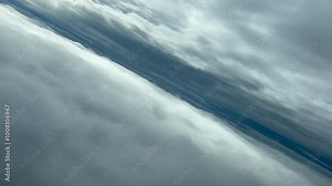 Pilot’s POV FPV flying between two layers of clouds. Aerial footage taken from an airplane cockpit. Immersive perspective. 4K 60FPS